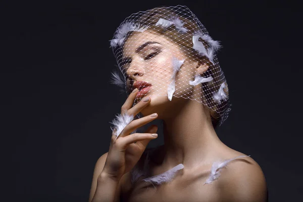 Beautiful girl in veil with feathers — Stock Photo, Image