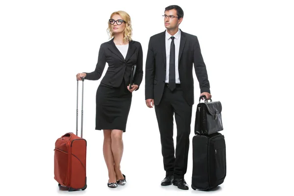 Businessman and business woman with travel cases — Stock Photo, Image