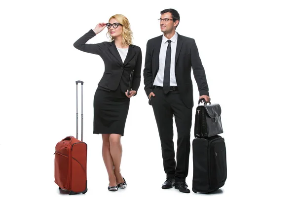 Businessman and business woman with travel cases — Stock Photo, Image