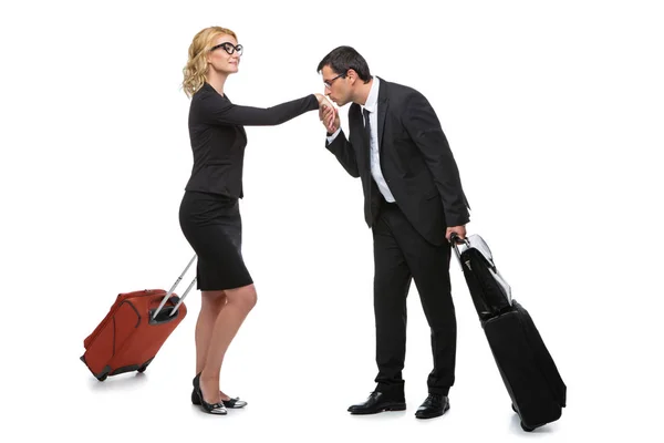 Businessman and business woman with travel cases — Stock Photo, Image