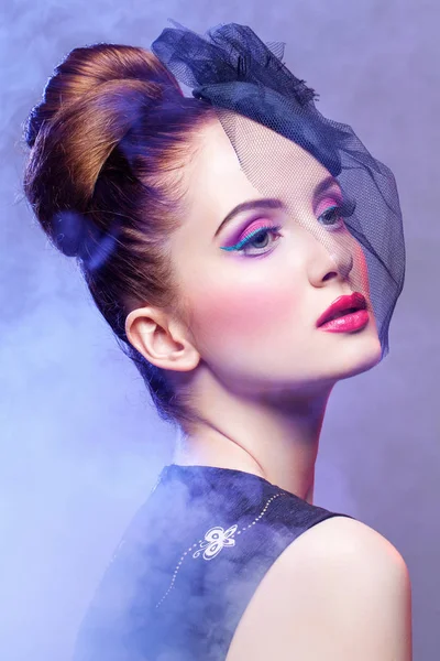 Beautiful girl with hairdo and bright make-up — Stock Photo, Image