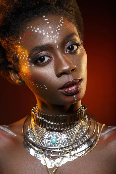 Beautiful afro girl with drawings on skin — Stock Photo, Image