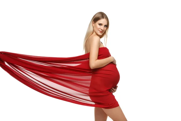 Pregnant girl in red dress — Stock Photo, Image