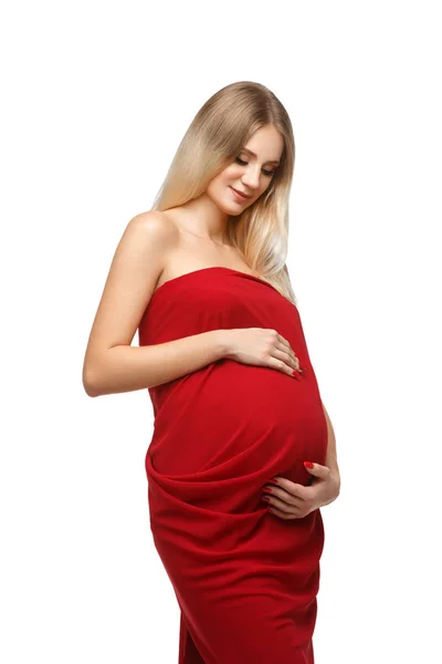 Pregnant girl in red dress — Stock Photo, Image