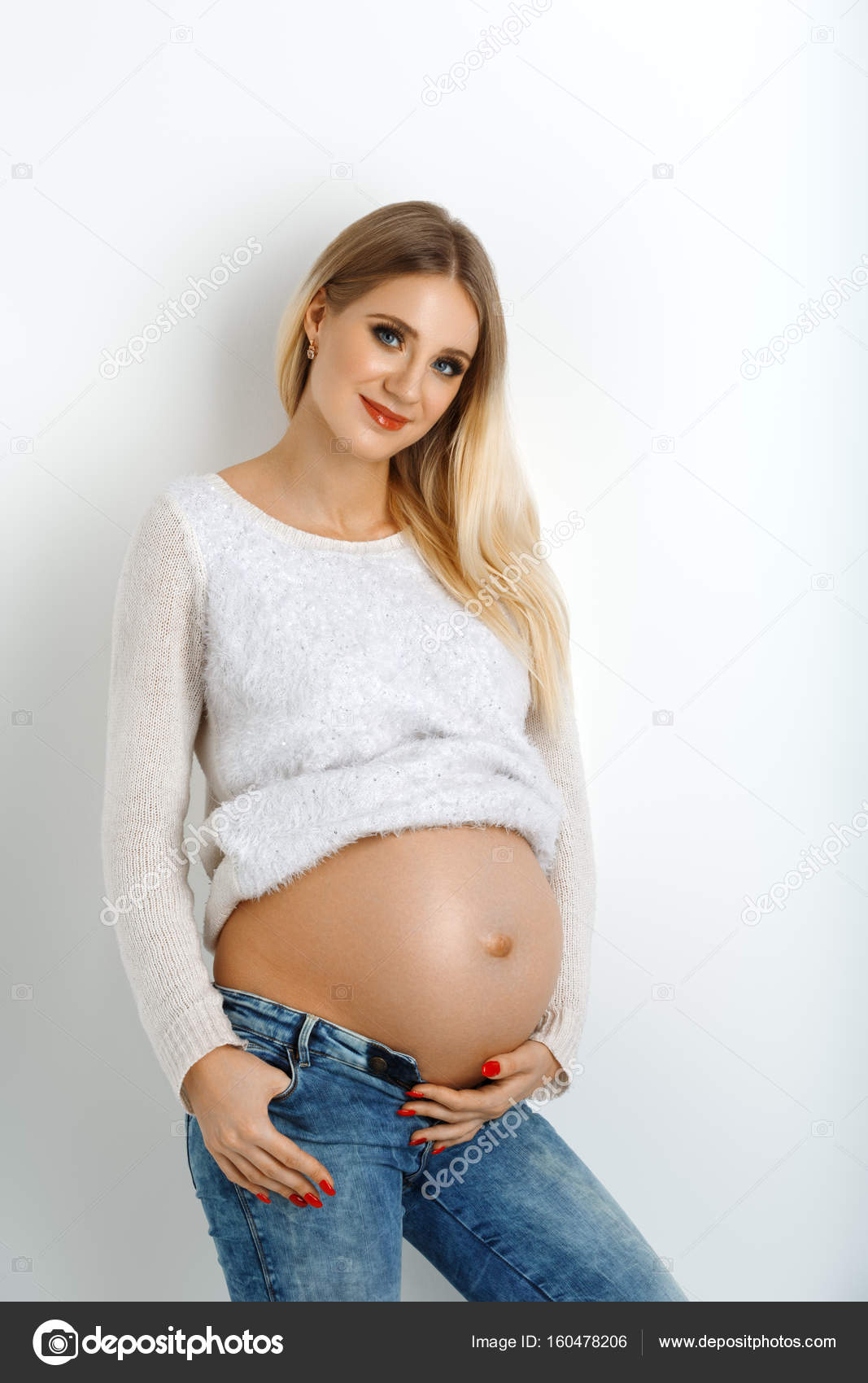 Pregnant woman in jeans and bra feeling sick, isolated on white background  Stock Photo - Alamy