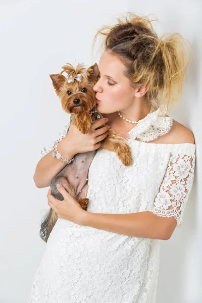 Girl in white dress with yorkie dog — Stock Photo, Image