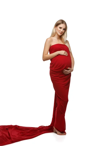 Pregnant woman in red dress — Stock Photo, Image