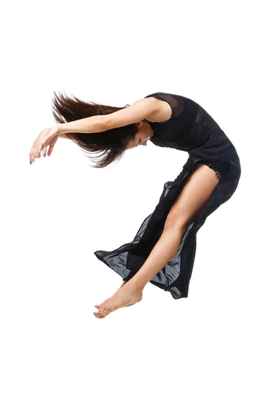 Modern dancer jumping in black dress — Stock Photo, Image