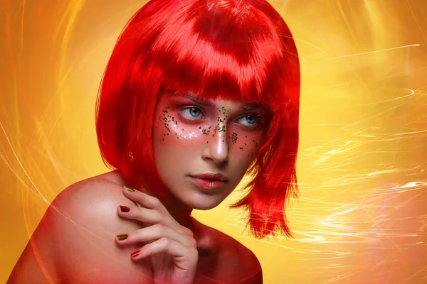 Beautiful woman posing in red wig — Stock Photo, Image