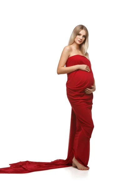 Pregnant woman in red dress — Stock Photo, Image