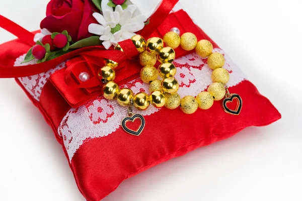 Pillow with golden rings — Stock Photo, Image