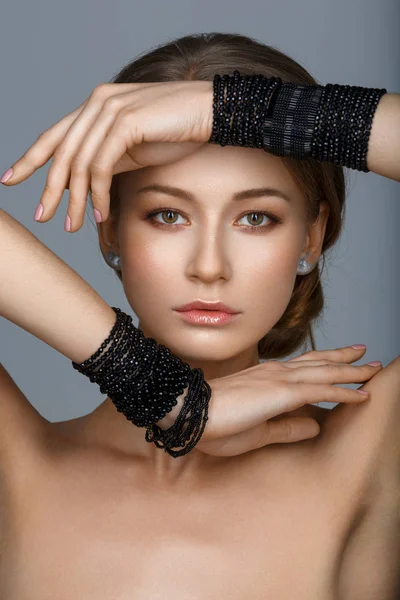 Woman with black bracelets — Stock Photo, Image