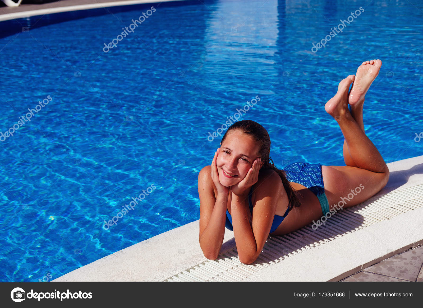 Teen girl relaxing near swimming pool Stock Photo by ©Svetography