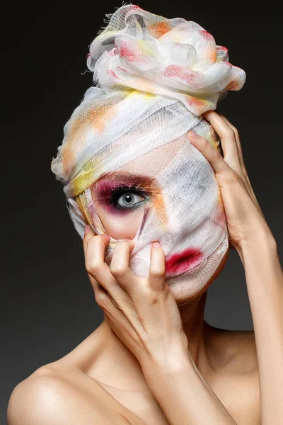 Girl with heavy makeup and bandage on head — Stock Photo, Image