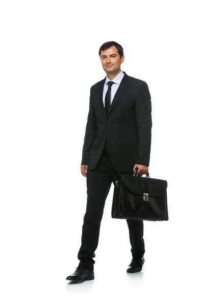 Handsome businessman in suit with briefcase — Stock Photo, Image