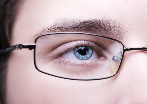 Portrait of a teen boy wearing glasses close, macro studio shoot — Stock Photo, Image