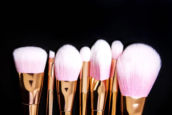 Professional makeup brushes collection on black background — Stock Photo, Image