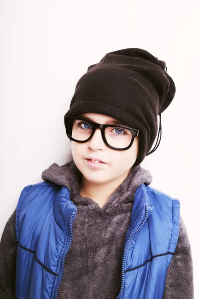 Handsome boy is wearing black cap and eyeglasses. Isolated on wh — Stock Photo, Image