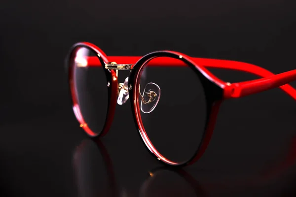 Fashion red black eye glasses isolated on black background — Stock Photo, Image