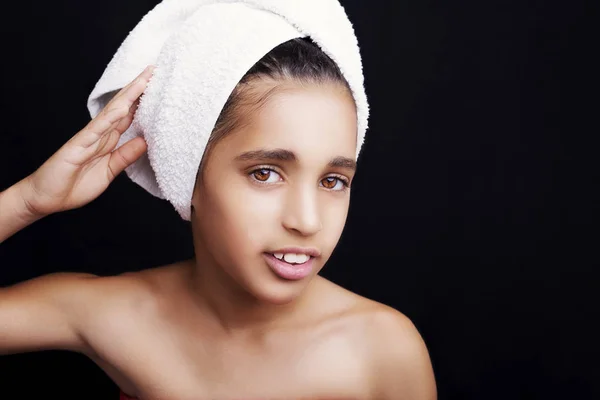 A little smiling girl with a towel on her head — Stock Photo, Image