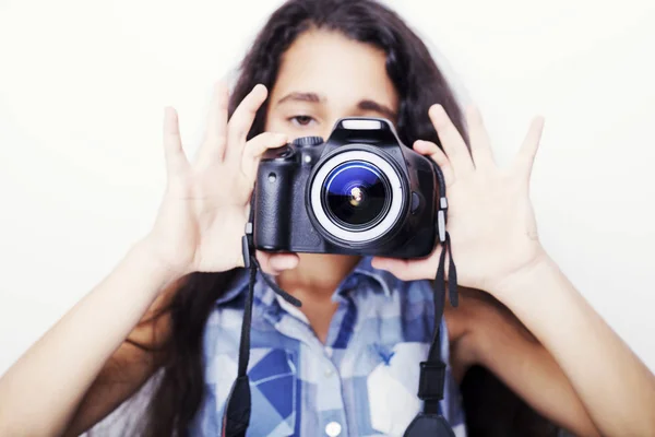 Cute brunette little girl holding an photo camera — Stock Photo, Image