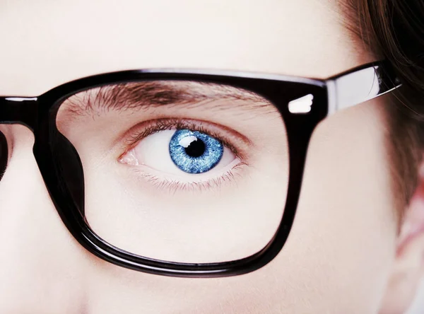 Portrait of a boy wearing eyeglasses blue eyes close, macro studio shot — Stock Photo, Image