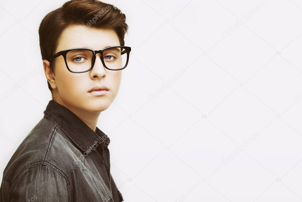 Stylish handsome young man posing on white background