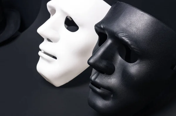 White and dark human masks — Stock Photo, Image