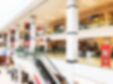 Bokeh 'le alışveriş merkezinin geçmişi bulanık. Arka plan olarak bulanık alışveriş merkezi koridoru