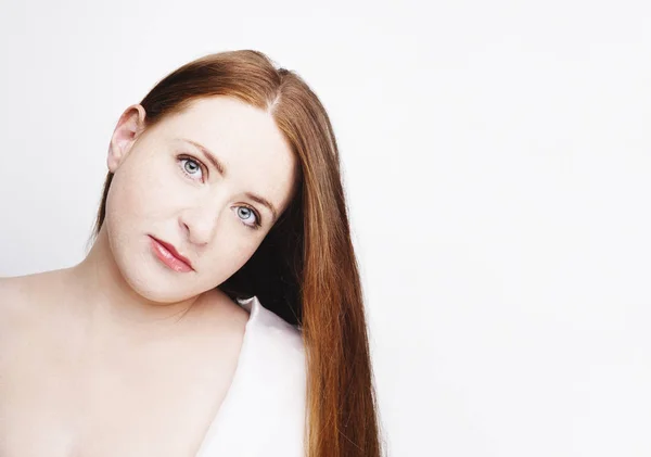 Beautiful young redhead woman with freckles portrait isolated on white — Stock Photo, Image