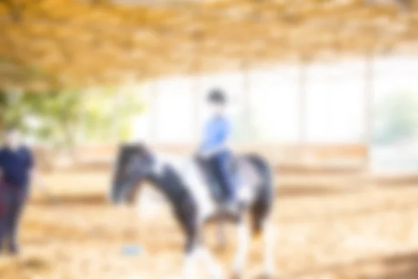 Abstract blurred background. Horse riding lessons for kids — Stock Photo, Image