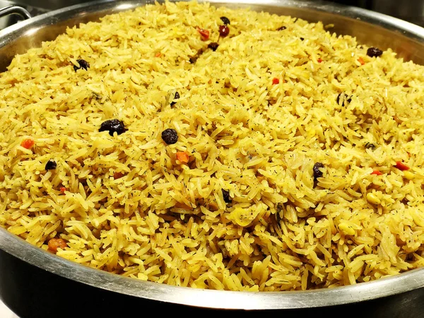 A colorful Indian rice dish made from basmati rices spices and fresh vegetables