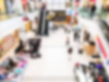 Bokeh 'le alışveriş merkezinin geçmişi bulanık. Arka plan olarak bulanık alışveriş merkezi koridoru