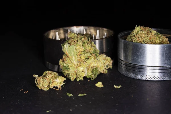 Metal grinder with marijuana, isolated on a black — Stock Photo, Image