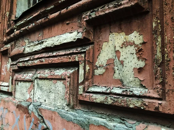 Texture background - wooden surface covered with old peeling paint, close up of peeling paint texture on the old texture background. Grunge texture surface with peeling paint