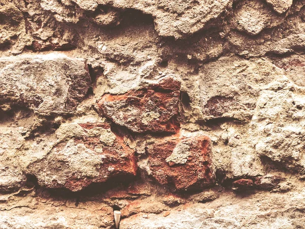 오래 된 베이지 석벽 배경 질감 이 닫 힙 니다. 돌벽의 질감. 오래 된 성곽의 돌벽 구조 배경. — 스톡 사진