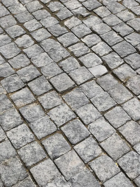 Steinplatten gepflasterte Straße. Nahaufnahme — Stockfoto