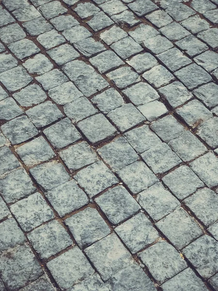 Steinplatten gepflasterte Straße. Nahaufnahme — Stockfoto