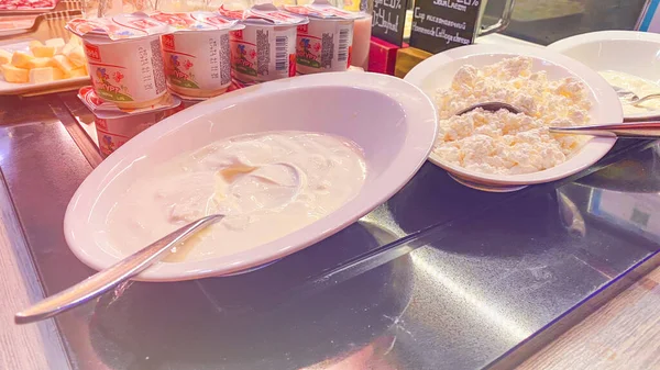 LVIV, UKRAINE - December 6, 2019: Yogurts, cottage cheese, sour cream, feta cheese are on the table for choice. — Stock Photo, Image