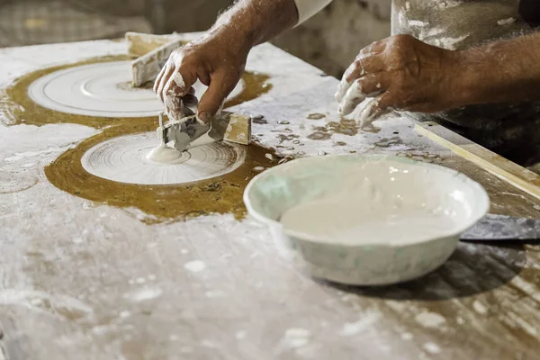Craftsman working and molding plaster — Stock Photo, Image