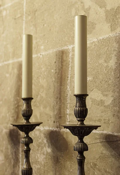 Old medieval candelabrum with wax candles — Stock Photo, Image