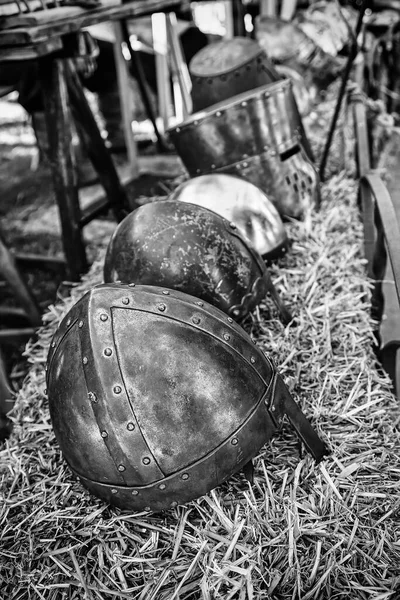 Old medieval helmets, detail of some ancient war helmets, protection and destruction