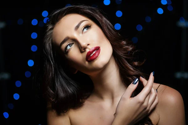 Beauty portrait with blue bokeh — Stock Photo, Image