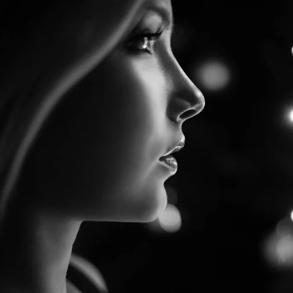 Beauty portrait of a sexy blonde with a magic lights — Stock Photo, Image