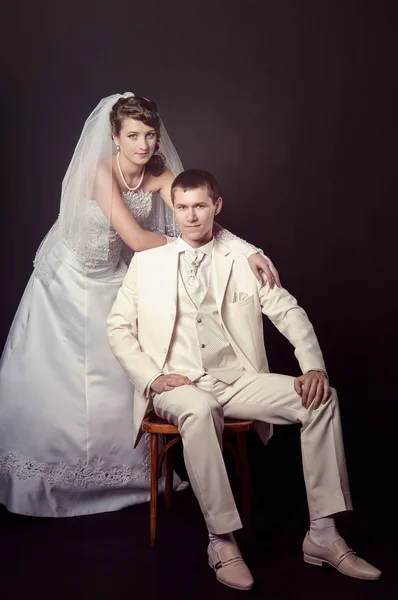 Groom and bride on a black background — Stock Photo, Image