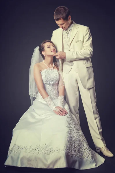 Groom and bride on a black background — Stock Photo, Image