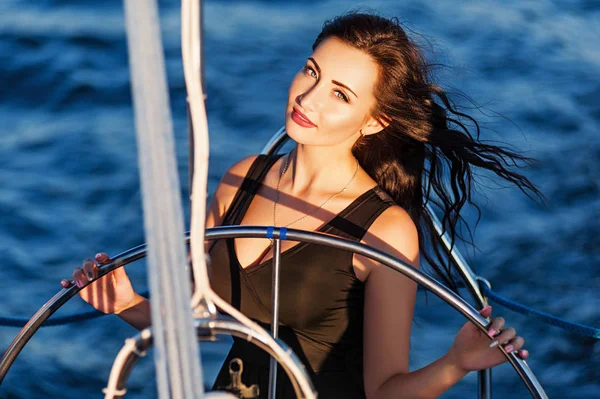 Beautiful woman posing on a yacht