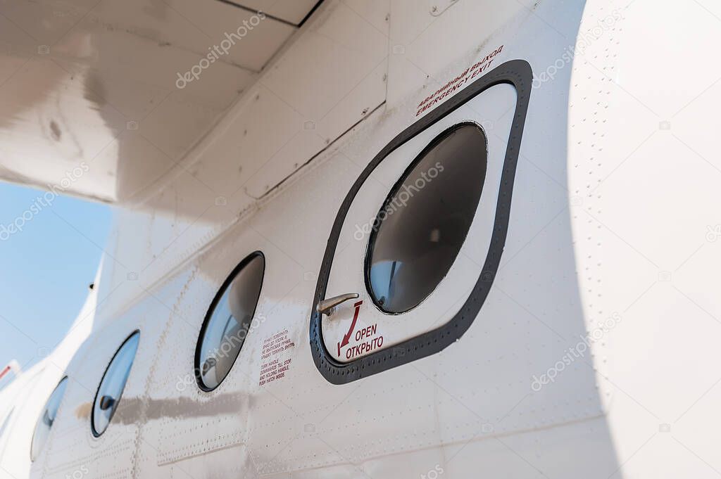 Close-up of parts of an AN-26 cargo plane. Emergency exit