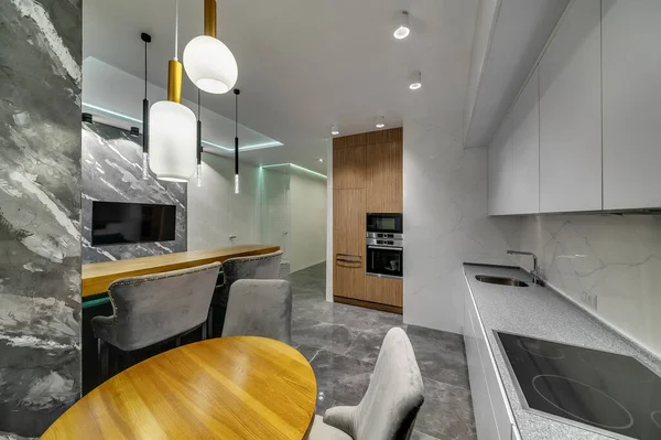 Interior design of a modern kitchen studio in a contemporary style