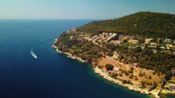 A water bike moves along the Mediterranean Sea, near the coast of the azure coast, a view from a drone — Stock Video